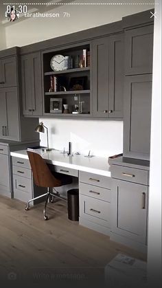 a home office with gray cabinets and white counter tops is featured in this image from the website