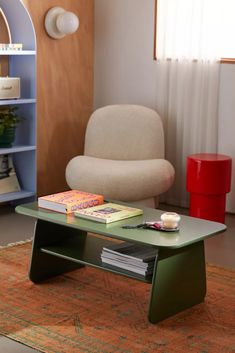 a coffee table with books on it in a living room