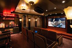 the interior of a home theater with chairs