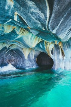 an image of the inside of a cave that looks like it is floating in the water