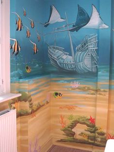 a bathroom with a painted mural on the wall