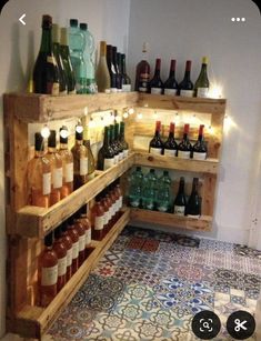 a wooden shelf filled with lots of bottles