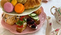 three tiered plates filled with different types of pastries