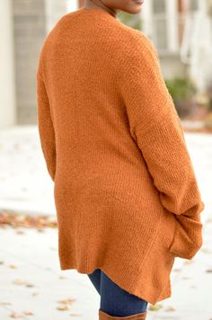 Add this rust colored cardigan to any ensemble for a nice cozy feeling. Two Pockets Model is wearing a Small Brown Knitted V-neck Cardigan, Brown V-neck Cardigan For Layering, Casual Brown Sweater With Soft Texture, Brown Knit V-neck Outerwear, Solid Soft Knit Cardigan For Fall, Brown V-neck Knitted Cardigan, Brown Fall Cardigan For Loungewear, Fall Cardigan For Loungewear, Cozy Sweater With Soft Texture For Fall