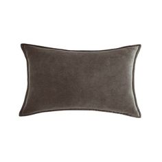 a gray velvet pillow on a white background