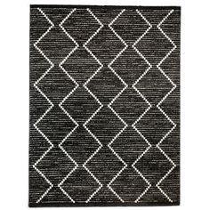 a black and white rug with diamonds on it