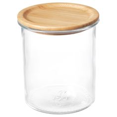 a glass jar with a wooden lid