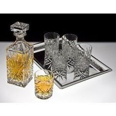 two glasses and a decanter on a tray