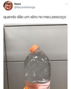 a plastic bottle filled with water sitting on top of a counter