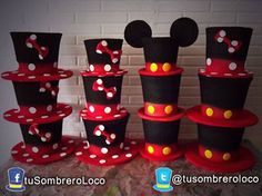 there are many hats made to look like mickey mouse ears and polka dots on them