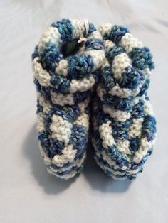 Soft comfy slippers for your adorable little one! Keep their little toes warm in these handmade knitted  slippers. Only high quality /vegan yarn /vegan thread are used in making these slippers. Machine wash and dry Handmade Cozy Yarn Slippers, Casual Hand Knitted Round Toe Booties, Cozy Knitted Yarn Slippers, Cozy Hand Knitted Round Toe Booties, Cozy Yarn Slippers With Round Toe, Comfortable Knitted Yarn Slippers, Comfortable Crochet Yarn Slippers, Crochet Yarn Slippers With Round Toe, Casual Crochet Yarn Slippers