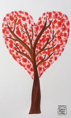 a paper heart shaped tree with red leaves