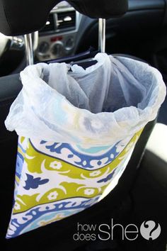 the inside of a car with a cloth bag in it