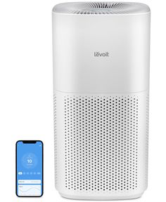 an air purificater next to a phone and appliance on a white background