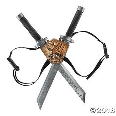 a knife with a skull on it and two knives attached to the blade, all connected together