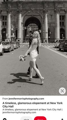 a black and white photo of a woman walking down the street