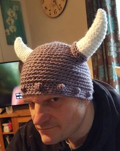 a man wearing a knitted hat with horns