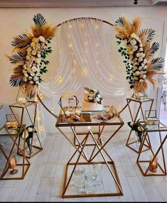 a table set up with flowers, candles and other items for a wedding or special event