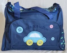 a blue bag with buttons on the side and a car in the middle is sitting on a white surface