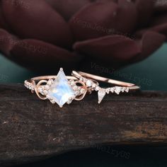 a rose cut diamond ring on top of a piece of wood