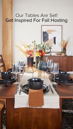 a dining room table set for four with place settings on it and the words our tables are set get inspired for fall hosting