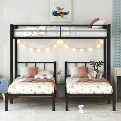 two twin beds in a bedroom with string lights