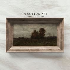 an image of a painting in a wooden frame with the words in cotton art written below it