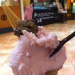 an ice cream sundae with toppings in a cone on the counter at a restaurant