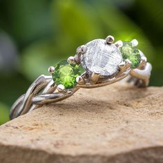 Peridot Birthstone Engagement Ring with Meteorite Meteorite Jewelry, Meteorite Ring, Nature Ring, Peridot Stone, Unique Wedding Bands, Three Stone Engagement, Peridot Ring, Shop Jewelry, Three Stone Engagement Rings