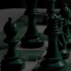 the chess pieces are all black and white in color, as well as one is gray