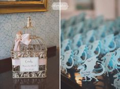 a birdcage filled with blue and white wedding favors