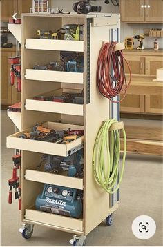 a workbench with various tools on it in a garage