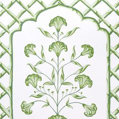 an ornate green and white design on the side of a building with lattices around it