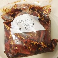 a bag of food sitting on top of a white plate covered in confetti