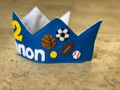 This felt birthday crown is sure to make your little one stand out with style! All shapes/flowers/embellishments are made by hand by me, making each crown one-of-a-kind! Crown will be finished with stitched edging all the way around, fitted with an elastic band around the back so it stays put on your child's head Felt Birthday Crown, Boys Costumes, Pokemon Birthday, Birthday Crown, Boy Costumes, Felt Ball, Smash Cake, Elastic Headbands, Sports Theme