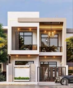 a white two story house with balconies on the second floor and balconyes