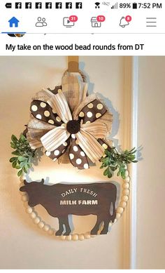 a cow is hanging on the wall next to a sign that says dairy fresh milk farm