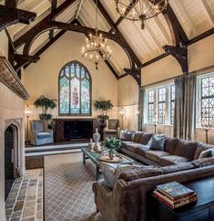 a living room filled with furniture and a fire place