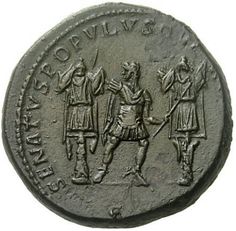 an ancient coin with two men holding swords and standing on one knee, in front of another