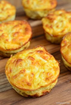 mini quiche pies on a wooden cutting board