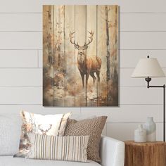 a deer is standing in the woods on a wooden paneled wall above a couch