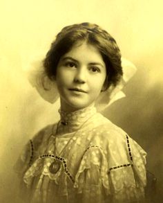 an old black and white photo of a woman