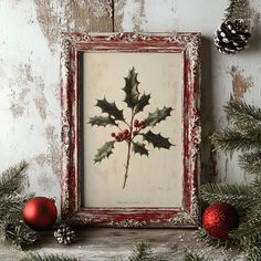 a painting with holly leaves and red berries on it next to christmas balls, pine cones and evergreen needles