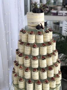 a wedding cake made out of wine bottles