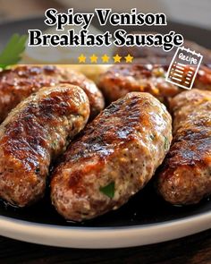 some sausages are sitting on a plate with the words spicy venison breakfast sausage