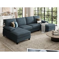 a living room with a sectional couch and coffee table