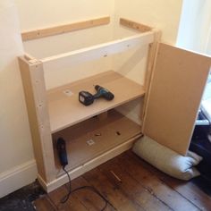 a shelf with some tools on top of it in a room that is being remodeled