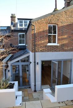 an outside view of a house with brick walls