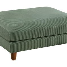 the footstool is made out of fabric and has wooden legs in front of it