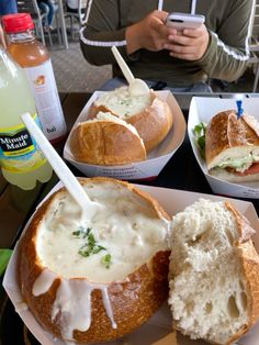 a person taking a picture of some food on a plate with a cell phone in front of them